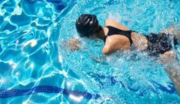 top-down image of a female swimmer in a pool