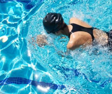 top-down image of a female swimmer in a pool
