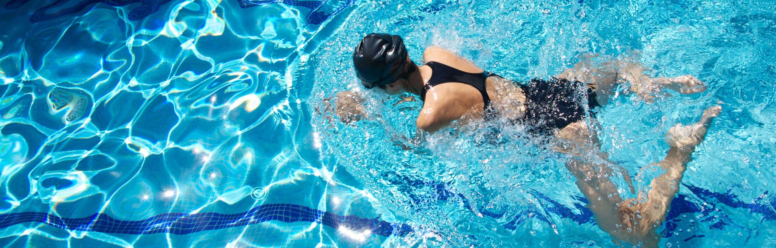 top-down image of a female swimmer in a pool